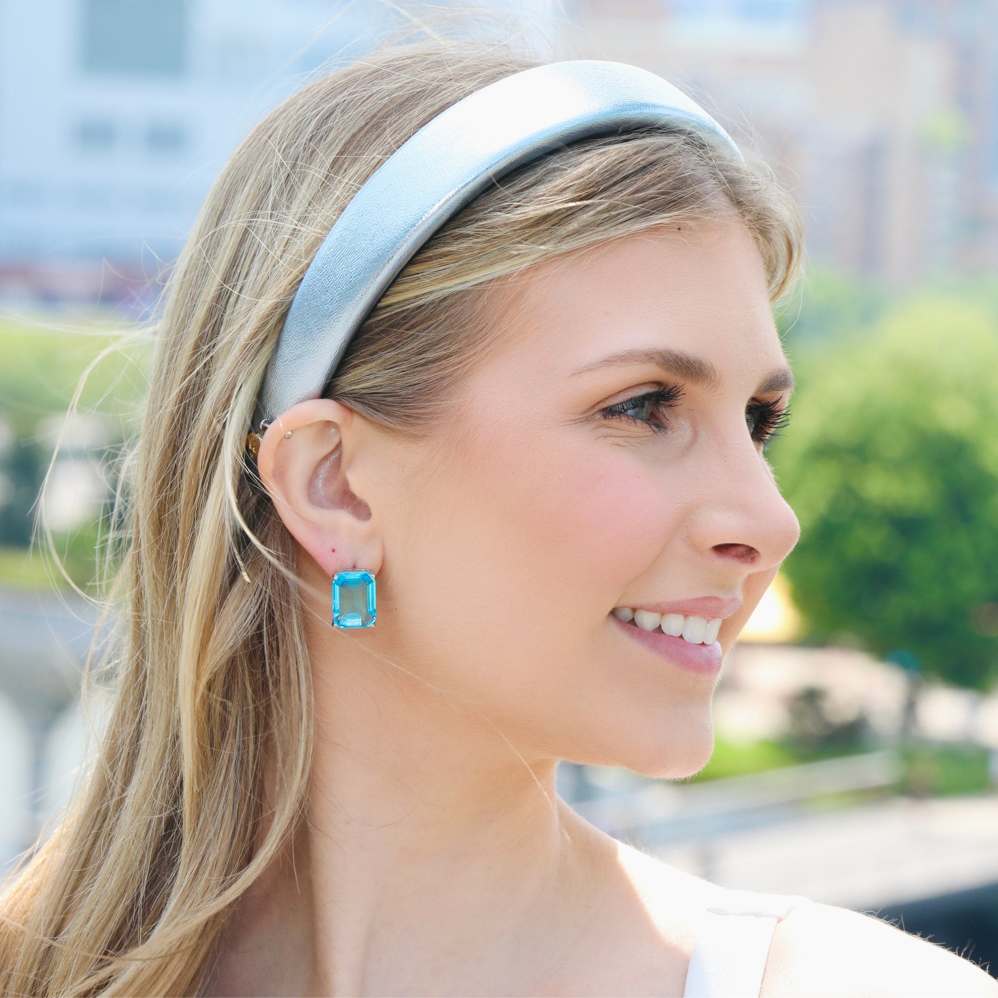 Faux leather blue headband with a sleek finish, perfect for adding a bold touch to any outfit.