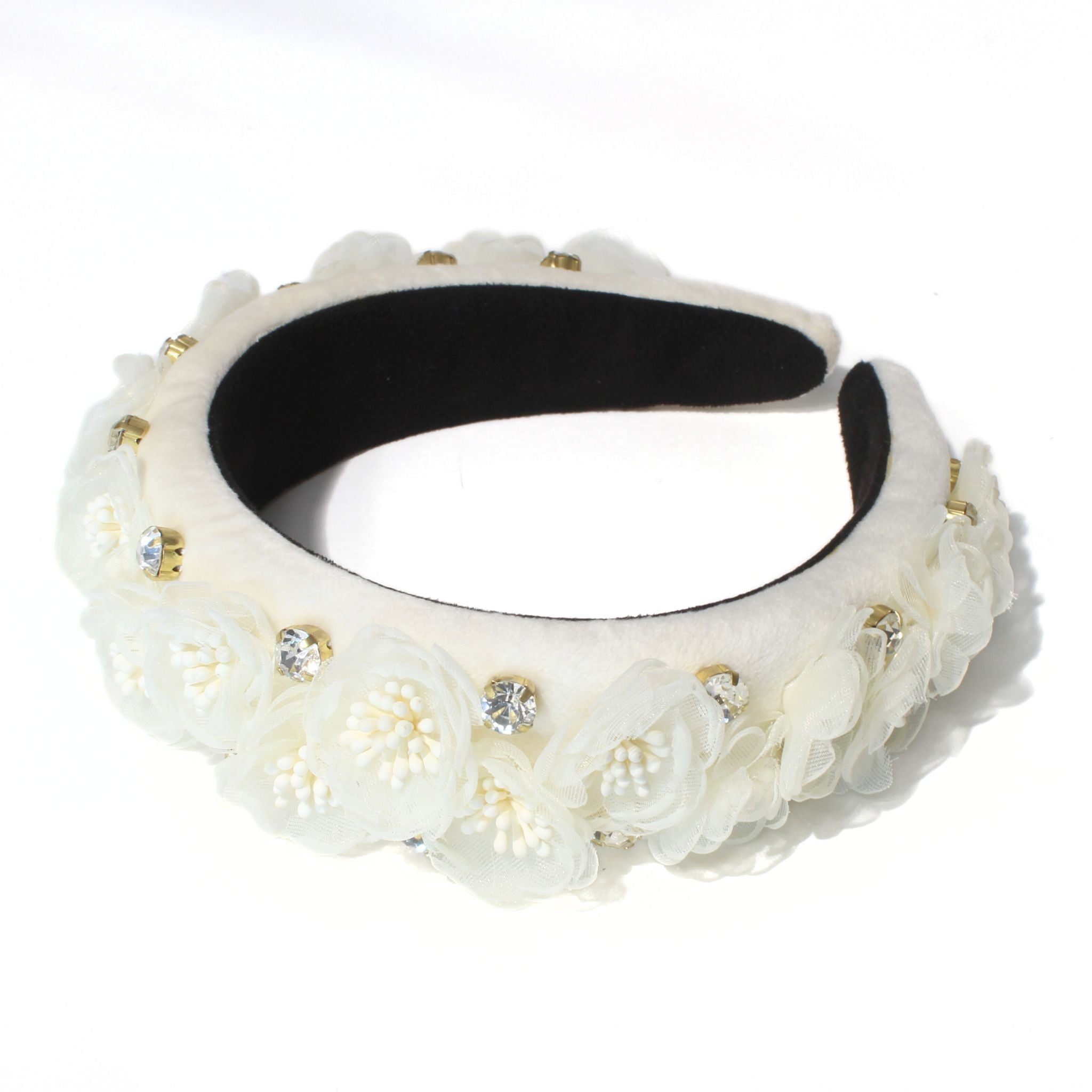 This snow white headband is made from delicate flowers and rhinestone accents, making it perfect for brides.