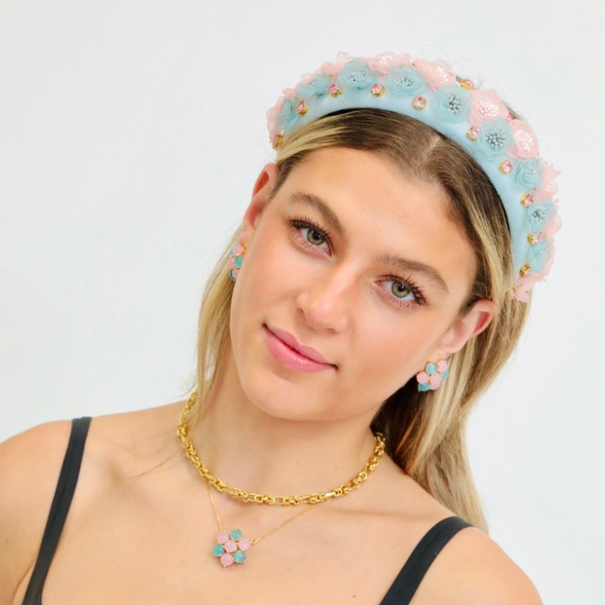 Whimsical flower crown-inspired headband in blue and pink, a charming accessory in headbands for women.