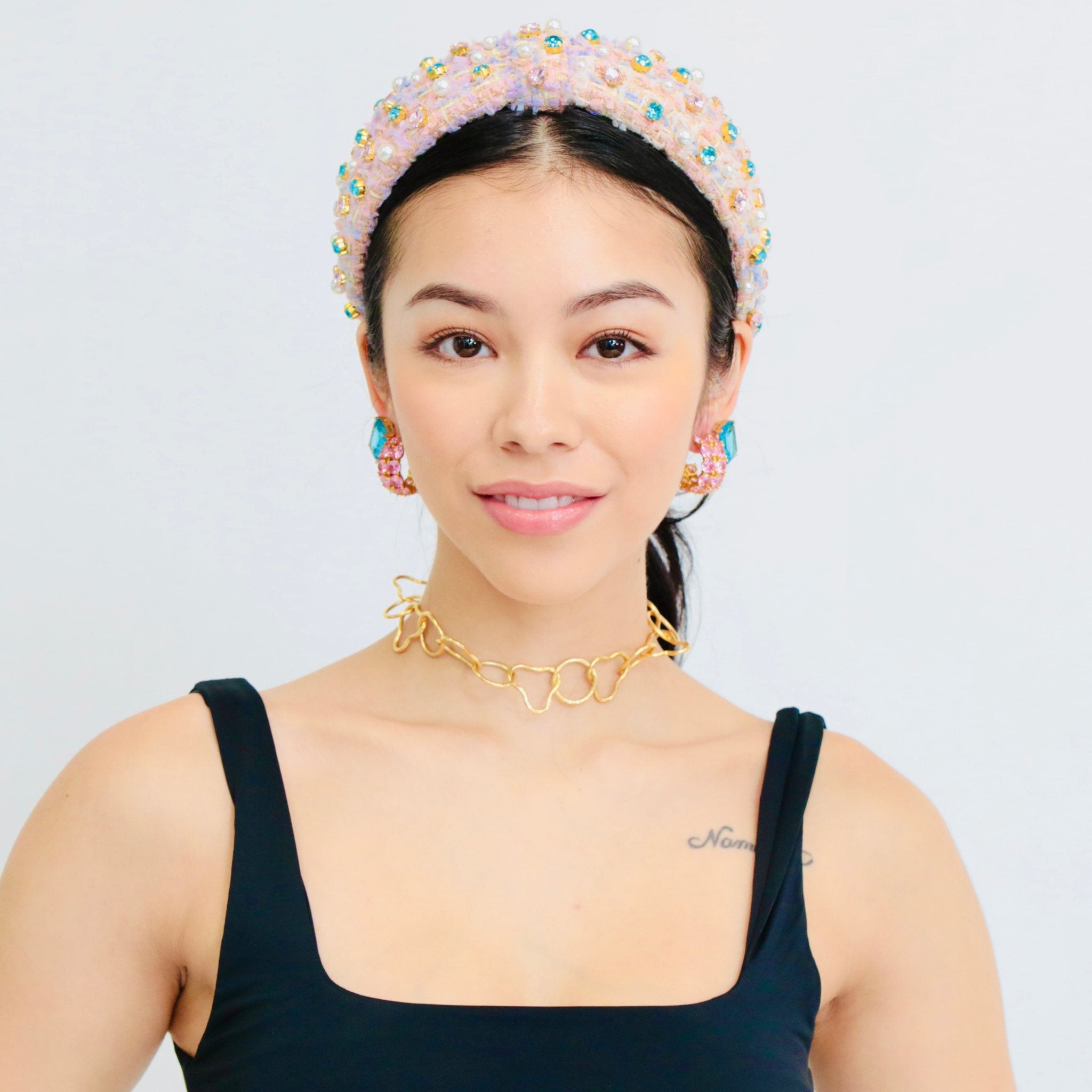 Designer headbands crafted from luxe pink tweed, a sophisticated hair band hair band for stylish occasions.