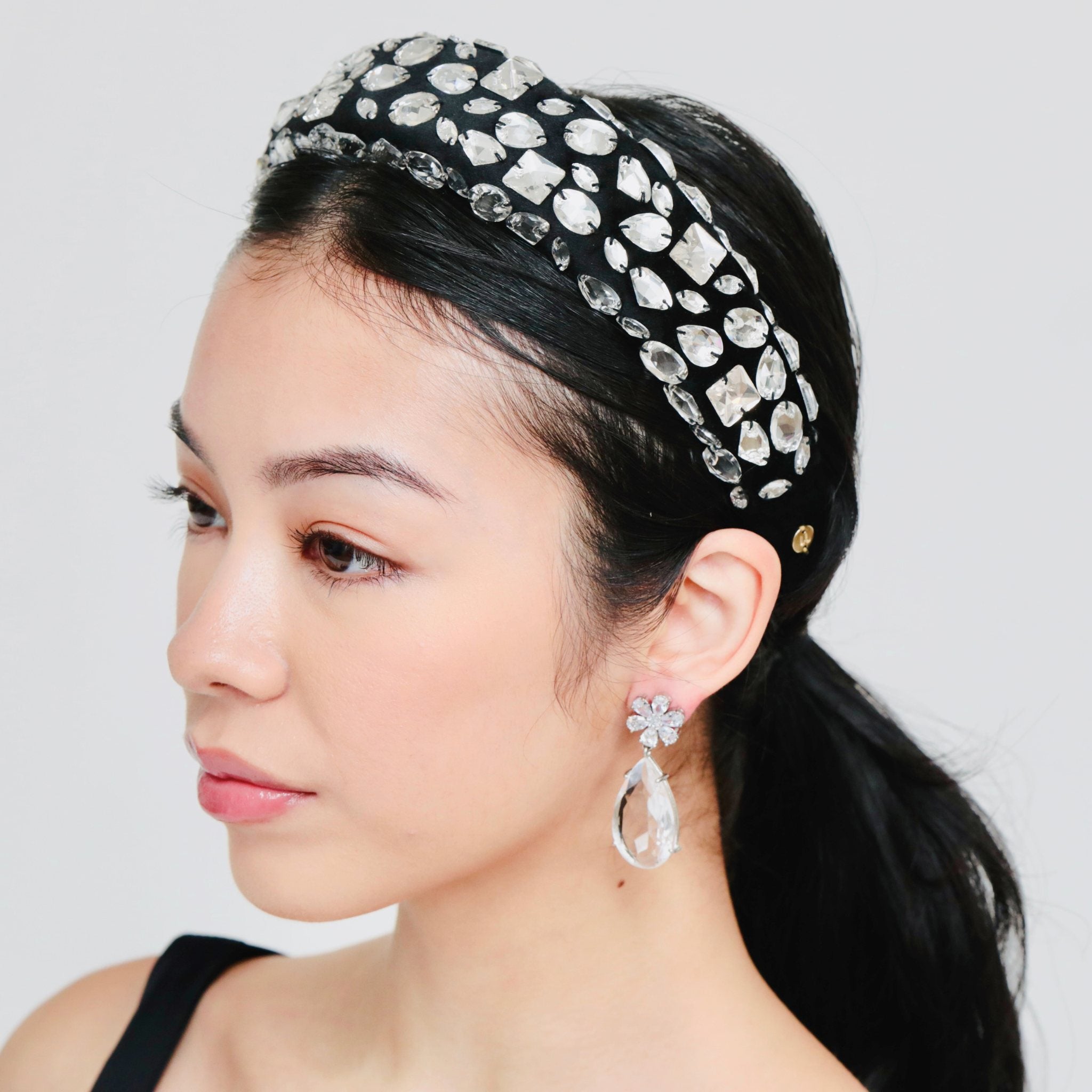 Head bands for girls with a black crystal design, offering elegance and sparkle for special occasions.