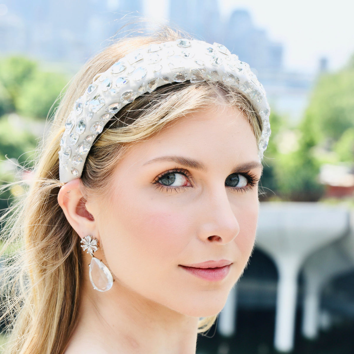 A bridal headband crystal-set along its full length, photographed close so the individual stones read.