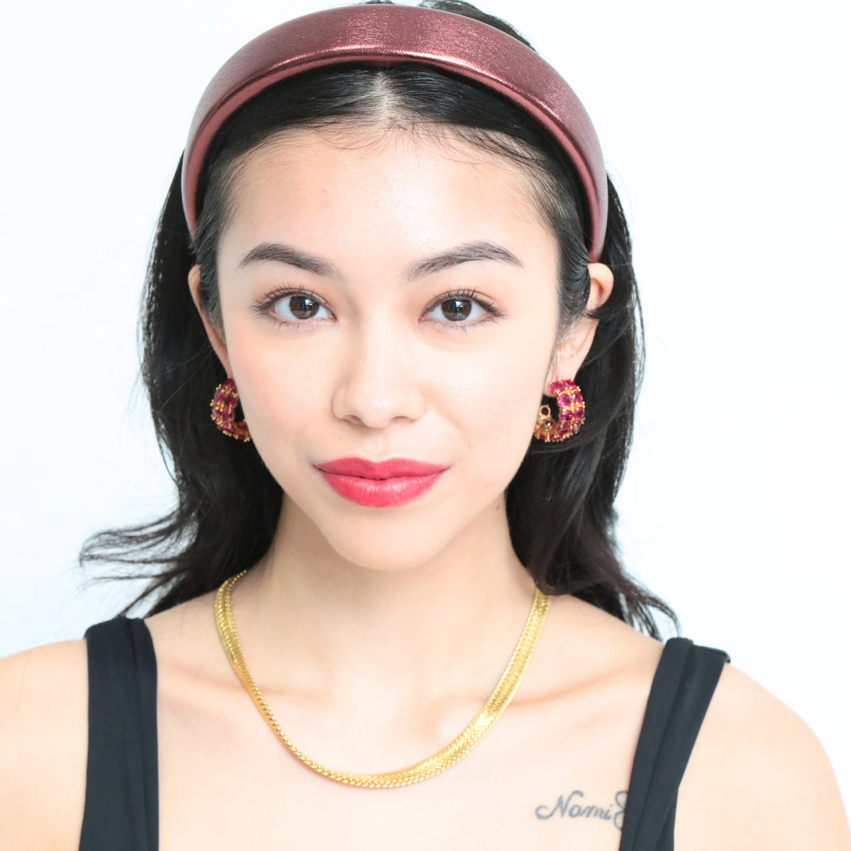 A closer look at this red headband's faux leather finish — one of our most versatile hair bands for women.