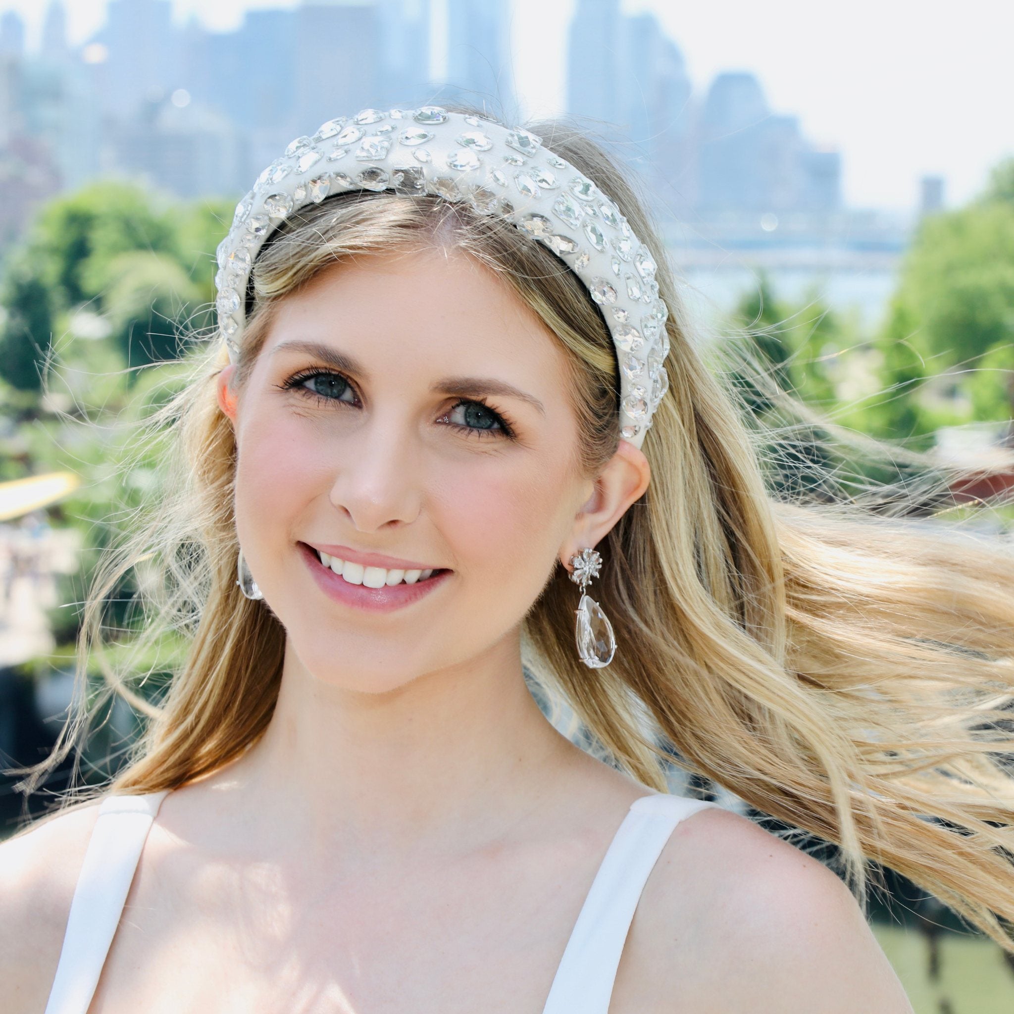 White headband adorned with dazzling crystals, perfect for adding elegance to any bridal look