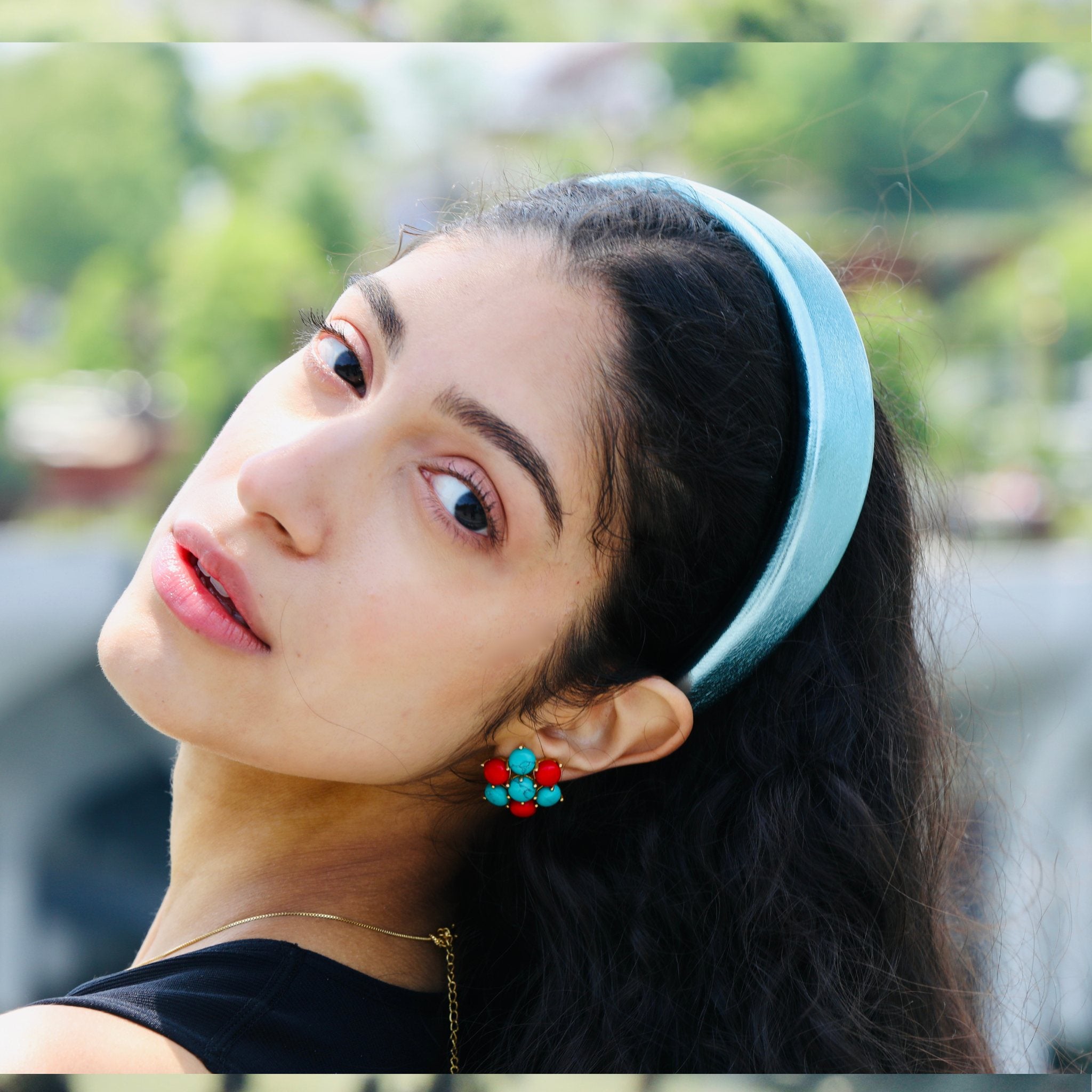 Womens headband in vibrant teal, offering a sleek faux leather finish with a comfortable fit.