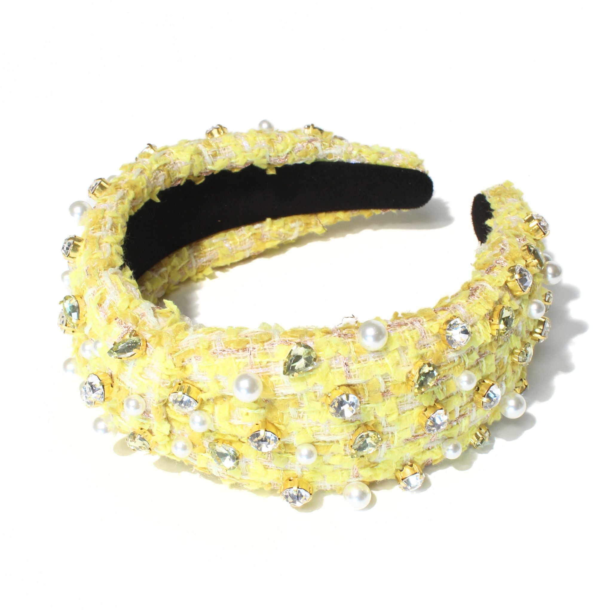 Yellow headband designed with a chic tweed texture, perfect for adding a stylish touch.