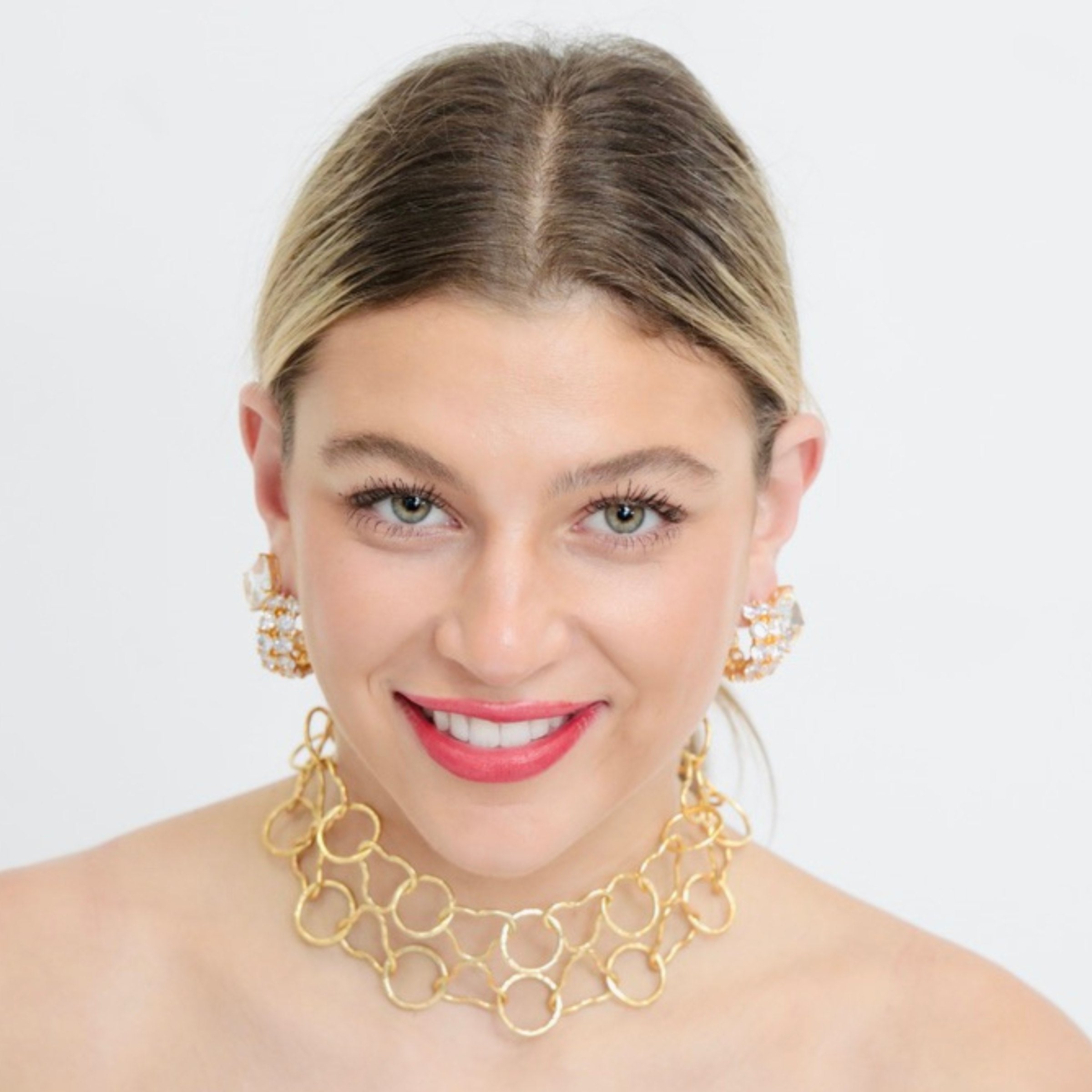 Statement necklace, Majesté, is designed in NYC. Pair it with cz diamond hoop and crystal stud earrings for red carpet look.