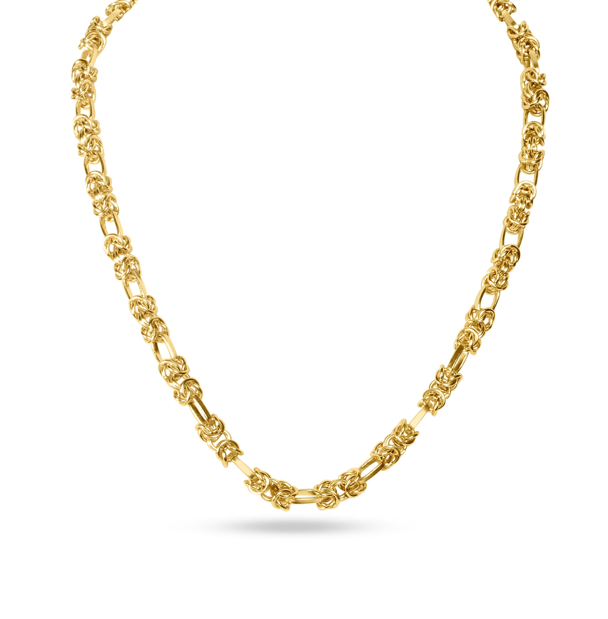 A close-up of the double chain necklace's structured links, shown here in gold.