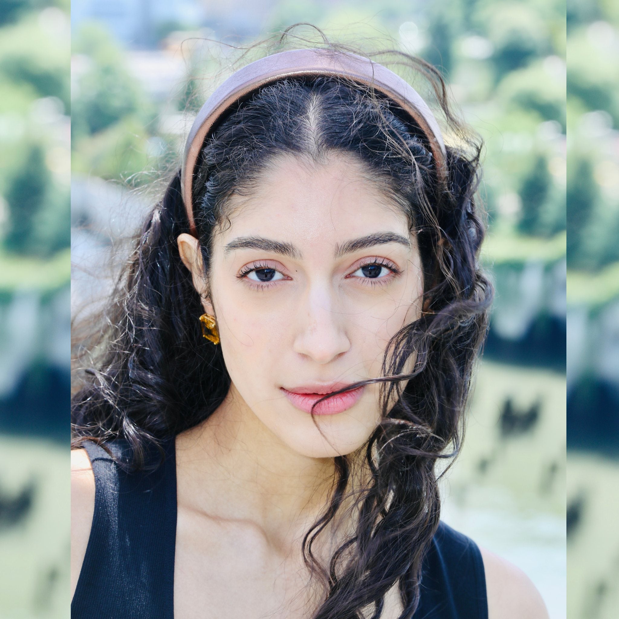 Designer headband in brown faux leather, featuring a padded design for all-day comfort and effortless style.