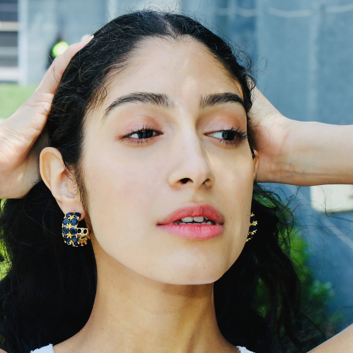 Navy blue and gold statement hoop earrings in a September birthstone shade