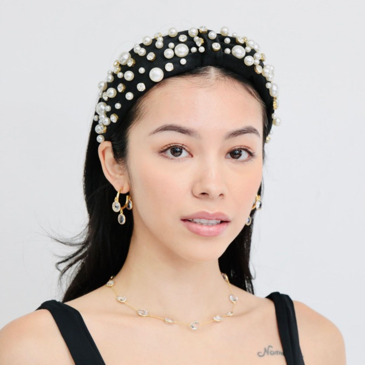 This crystal necklace with gold detailing is perfect as part of a layered necklace set, whether worn alone or paired with your favorite chains.